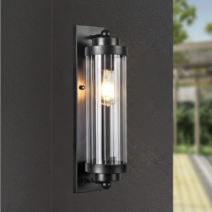 Milan industrial exterior wall sconce with ribbed glass cylinder, matte black, IP54