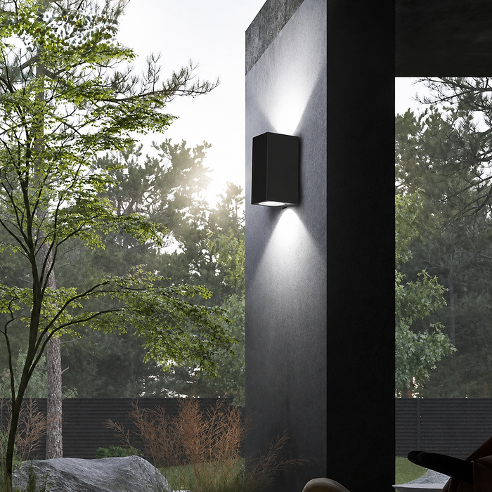 Axis black up and down wall light with cool white illumination on a porch column. Style illustration.